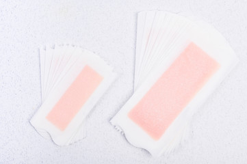 Wax strips for hair removal on a white background. Spa and beauty treatments. Free space for text. Copy space.
