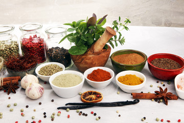 Spices and herbs on table. Food and cuisine ingredients with basil