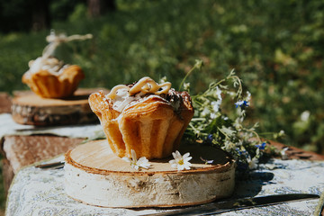 Glass and cake on a Sunny table, a bouquet of spring flowers for mood