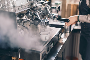 Steam near the group espresso machine in the cafe
