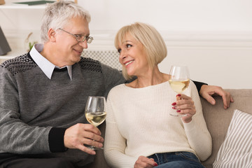 Loving Senior Couple Drinking Wine, Celebrating Anniversary