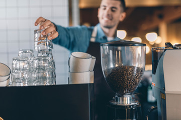 Selective focus of the pile of clean glasses in the cafe