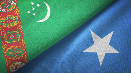 Turkmenistan and Somalia two flags textile cloth, fabric texture