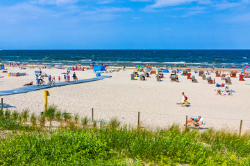 Сrowded Baltic beach on Usedom island in Swinoujscie resort, Poland. It borders the German seaside...
