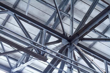 Perspective from the bottom to the frame roof of a warehouse or workshop