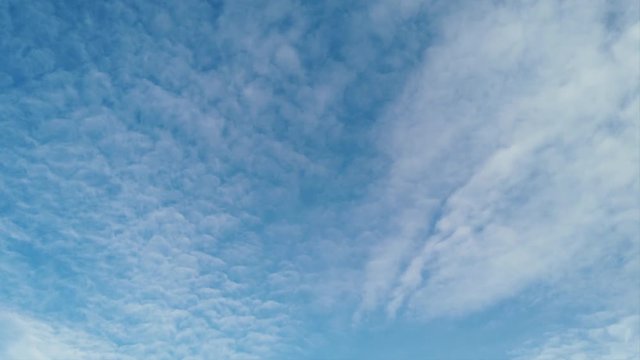 Beautiful summer blue sky and cirrocumulus clouds in timelapse
