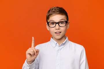 Smart teen boy in glasses having idea