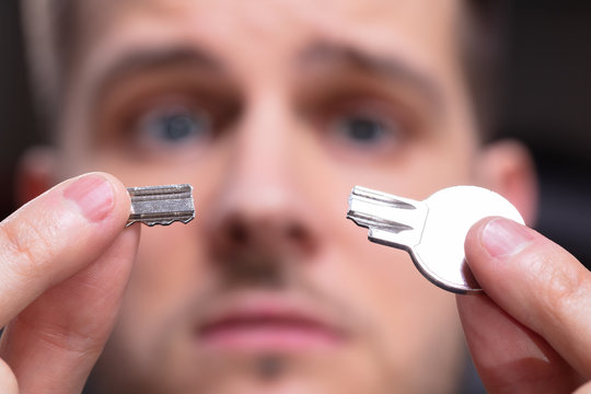 Shocked Person Showing Broken Key
