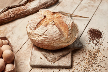 Fresh homemade bread on wooden background. Crisp. French bread. Bread at leaven. Unleavened bread.