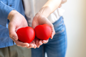 Red hearts in the hands
