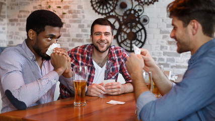 Play Cards. Diverse Friends Having Rest In Bar