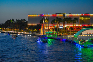 Tampa Bay, Florida. March 02, 2019 Illuminated Tampa Museum of Art, Riverwalk and boats sailing on...