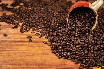 A mug and coffee beans composition.