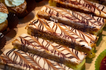 Freshly baked stuffed sweet Millefeuille pastries in traditinal French bakery in small village in Provence