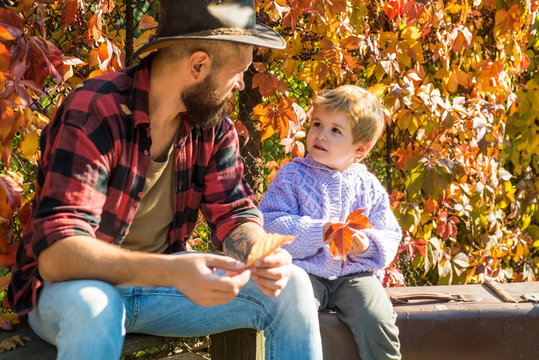 Bearded Dad Telling Son About Travelling. Traveler With Lot Experience. Fatherhood And Upbringing. Family Time. Adventure With Son. Telling Stories About Past Times. Father With Suitcase And His Son