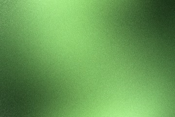Glowing rough green metal wall surface, abstract texture background