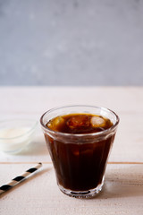 glass of iced coffee on white wooden table