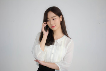 Fototapeta na wymiar portrait of thai china adult office girl white shirt walk and calling smart phone