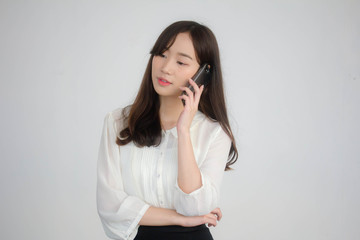 Fototapeta na wymiar portrait of thai china adult office girl white shirt walk and calling smart phone