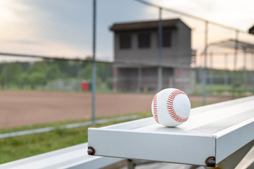  baseball on bleachers at a baseball field 