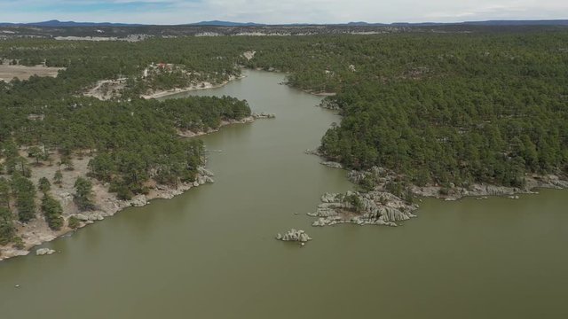 Aerial Drone view of Arareco Lake with bird flying, Chihuahua, Mexico