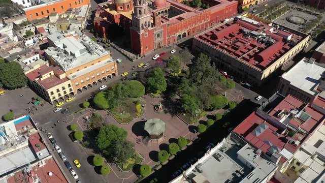 Aerial drone view over Zenea Garden and San Francisco Temple in Queretaro City, Mexico