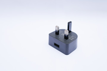 Black USB charger head/adapter isolated on a white background