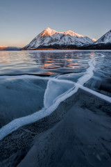 winter landscape with mountains and frozen lake