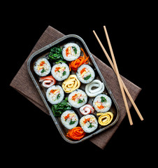 Set of kimbub or sushi roll in steel plate ready to serve in korean style menu with chopstick.