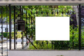blank wooden board on a fence