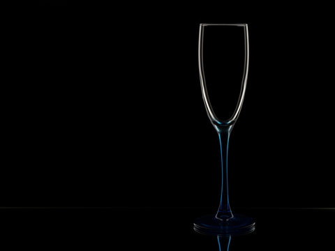 Elegant picture of champagne glass over the black background