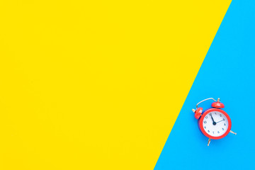 Abstract creative flat lay vintage yellow blue table top view office background concept red clock on paper color in minimal style, Hot summer holiday time to break workplace at noon for lunch, Retro