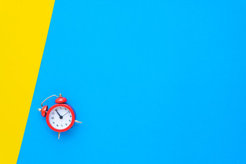 Abstract creative flat lay vintage yellow blue table top view office background concept red clock on paper color in minimal style, Hot summer holiday time to break workplace at noon for lunch, Retro