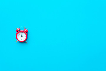 Abstract creative flat lay vintage blue table top view office background concept red clock on paper color in minimal style, Hot summer holiday time to break workplace at noon for lunch, Retro