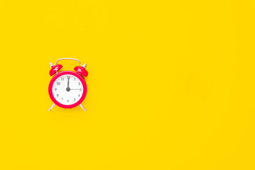 Abstract creative flat lay vintage yellow table top view office background concept red clock on paper color in minimal style, Hot summer holiday time to break workplace at noon for lunch, Retro