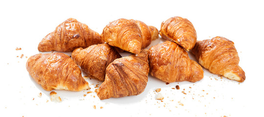 Freshly baked croissants  isolated on white background .