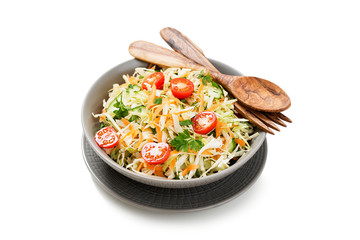 Fresh Cabbage salad with carrots and greens. isolated on white background.