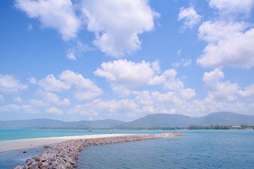 Fototapeta na wymiar Beautiful seascape with stone brakwater on the beach.