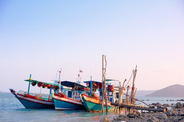 Traveling by Thailand. Ocean, beach and old fishing boat.