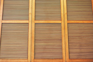 Wooden shutters, louvers. Textured background.