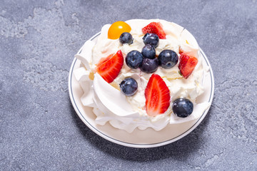 White cake, Meringue with fruits and berries