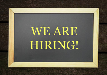We are hiring, words printed on board