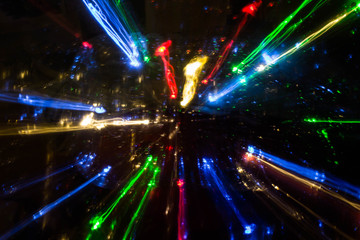 Сolorful traces of lanterns, headlights, receding into the distance in fast motion, unreal,...