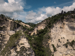Wooden house on tropical beach cliff