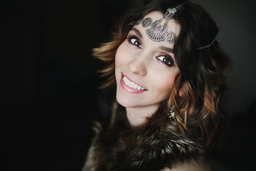 Fototapeta premium Close up portrait tribal style of beautiful woman wearing jewellery and fur