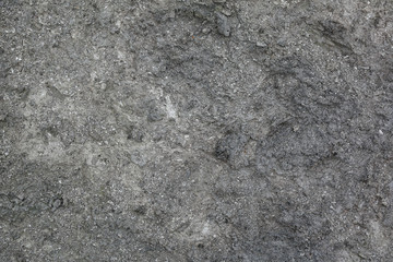 Grey sand background. Texture of ground.