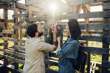 Happy family: mother father and child in mountains. 