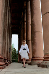 Fashion look's woman. Young woman modern portrait. Young woman dressed in white skirt and shirt...
