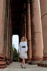 Fashion look's woman. Young woman modern portrait. Young woman dressed in white skirt and shirt...