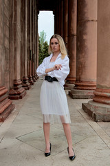 Fashion look's woman. Young woman modern portrait. Young woman dressed in white skirt and shirt...